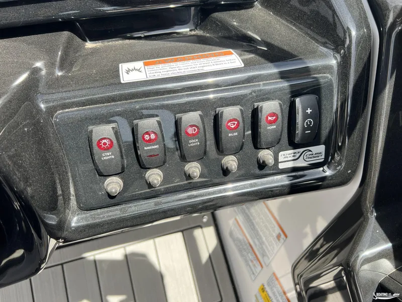 Slide: The Image of Control panel of 2025 Yamaha Boats 195S with labeled switches and warning label. - 13
