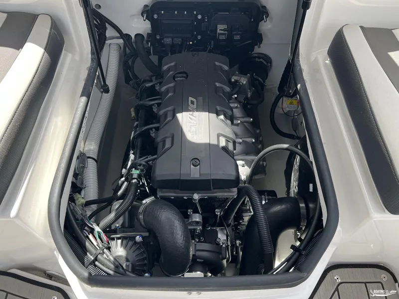 Slide: The Image of Engine compartment of a 2025 Yamaha Boats 195S, showcasing the powerful engine layout. - 17