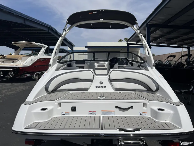 Slide: The Image of 2025 Yamaha Boats 195S, rear view, showcasing sleek design and spacious seating. - 3