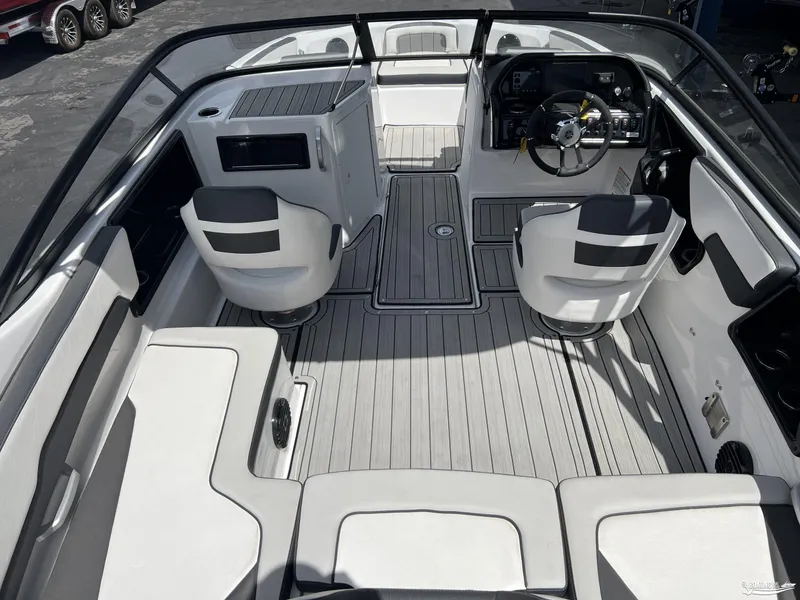 Slide: The Image of 2025 Yamaha Boats 195S interior with modern seating and sleek dashboard design. - 4