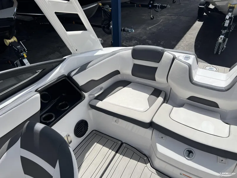 Slide: The Image of 2025 Yamaha Boats 195S interior with cushioned seating and cup holders. - 6