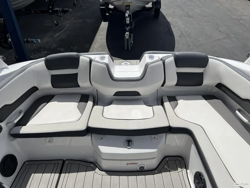 Slide: The Image of 2025 Yamaha Boats 195S interior seating with sleek, modern design and comfortable cushions. - 7