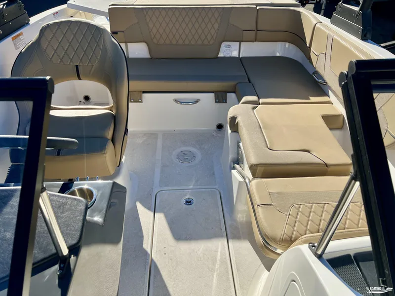 Slide: The Image of 2025 Bayliner VR5 boat interior with beige seating and modern design. - 4