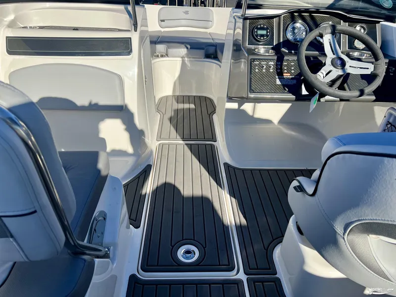 Slide: The Image of 2025 Bayliner VR5 boat interior with modern dashboard and seating. - 5