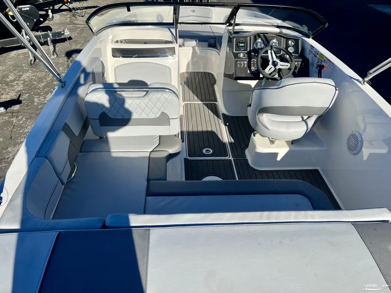 Slide: The Image of 2025 Bayliner VR5 boat interior with seating and steering console. - 6