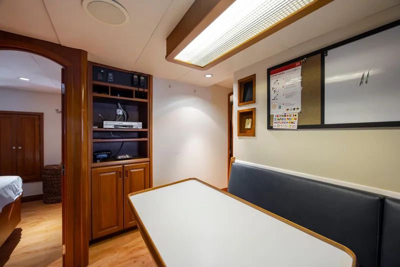 Slide: The Image of 1988 Christensen Custom yacht on water under blue sky. - 127