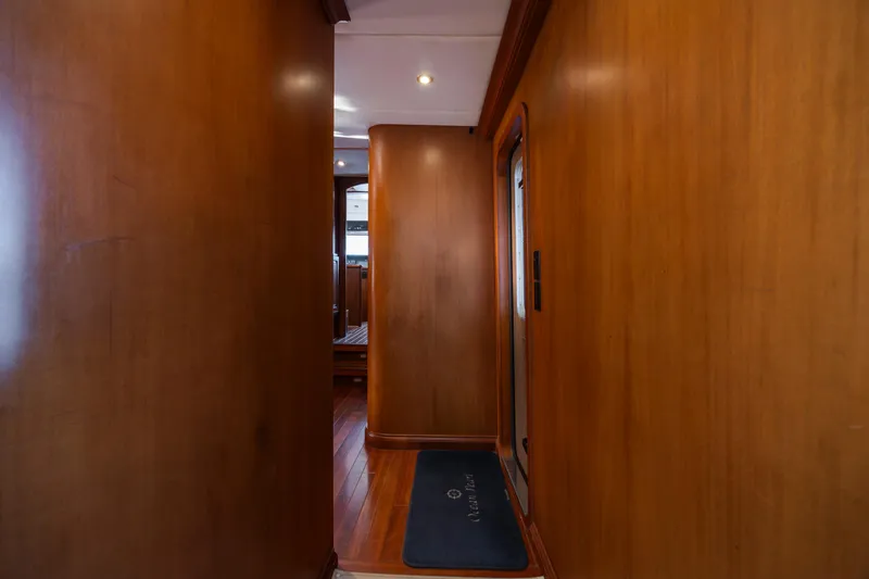 Slide: The Image of Wood-paneled hallway in a 1988 Christensen Custom yacht. - 22