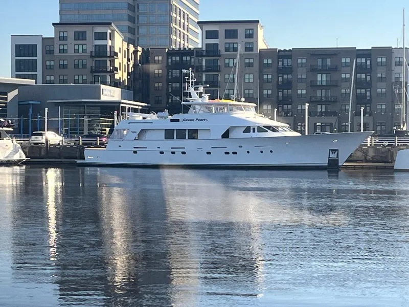 Slide: The Image of Luxury 1988 Christensen Custom yacht docked in urban marina setting. - 3
