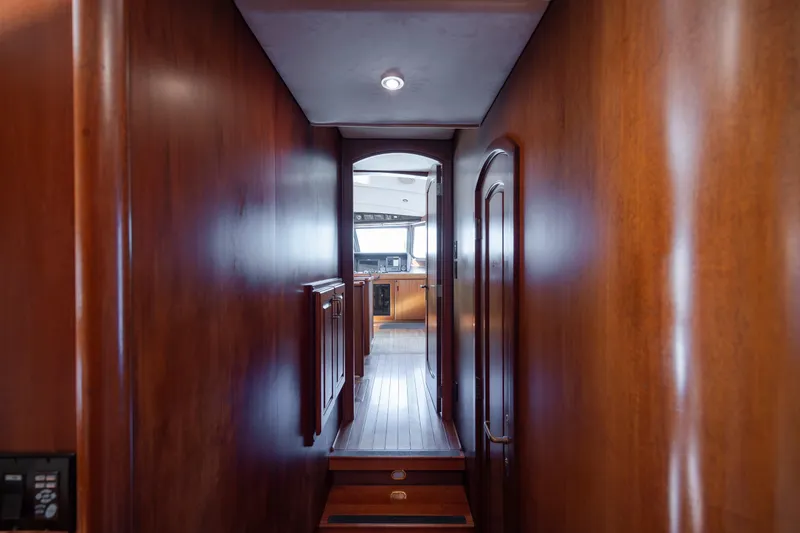 Slide: The Image of Wood-paneled hallway on a 1988 Christensen Custom yacht. - 33