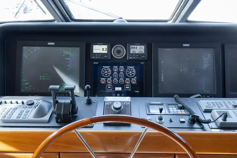 Slide: The Image of 1988 Christensen Custom yacht helm with modern navigation instruments. - 43