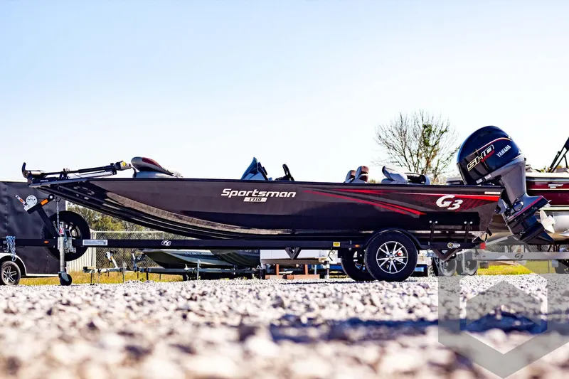 Slide: The Image of 2025 G3 Sportsman 1710 boat on trailer, parked outdoors. - 14