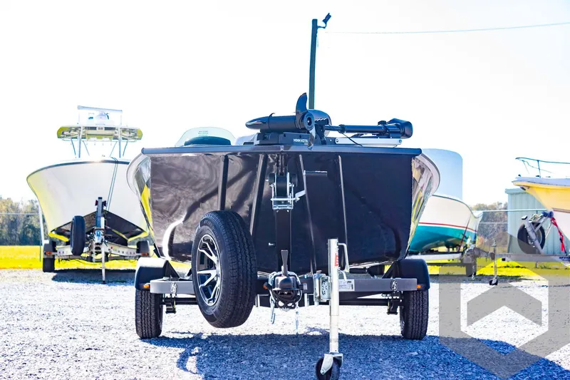 Slide: The Image of 2025 G3 Sportsman 1710 boat on trailer, parked outdoors. - 15