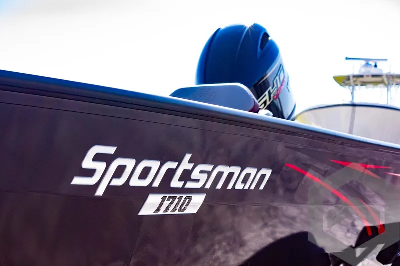 Slide: The Image of 2025 G3 Sportsman 1710 boat with helmet on deck, close-up view. - 24