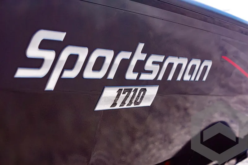 Slide: The Image of Close-up of 2025 G3 Sportsman 1710 logo on boat exterior. - 25
