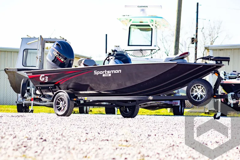 Slide: The Image of 2025 G3 Sportsman 1710 boat on trailer, outdoor display. - 3