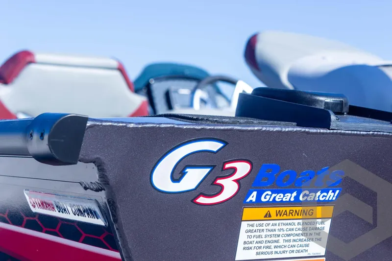 Slide: The Image of 2025 G3 Sportsman 1710 boat with logo and warning label, close-up view. - 31