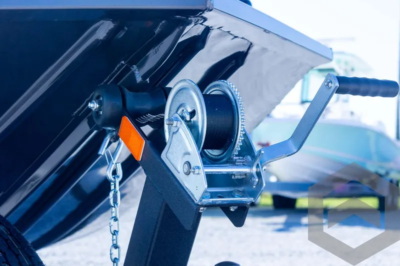 Slide: The Image of 2025 G3 Sportsman 1710 boat trailer winch close-up with chain and handle. - 36