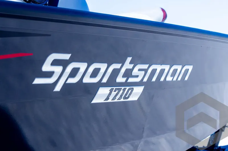 Slide: The Image of 2025 G3 Sportsman 1710 boat logo on dark hull. - 38