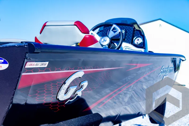 Slide: The Image of 2025 G3 Sportsman 1710 boat, sleek design with red accents and modern steering console. - 39