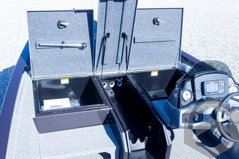 Slide: The Image of 2025 G3 Sportsman 1710 boat interior with open storage compartments and control panel. - 41