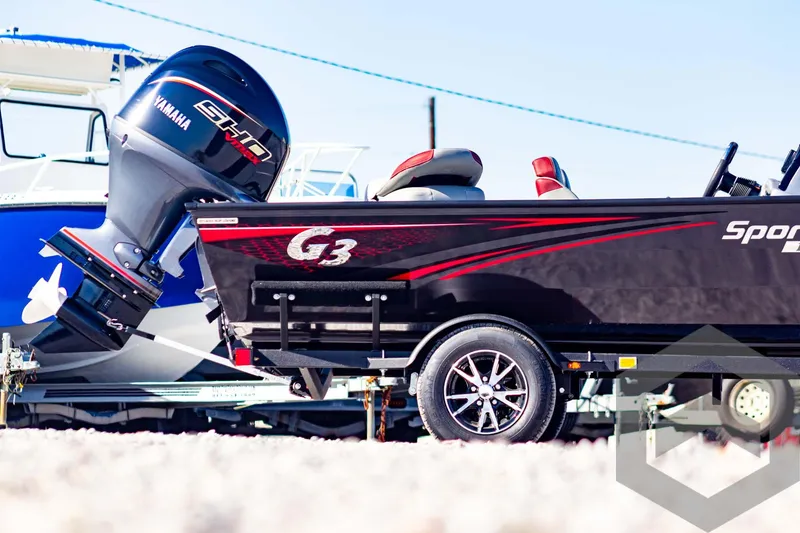 Slide: The Image of 2025 G3 Sportsman 1710 boat with Yamaha engine, parked on a trailer. - 5