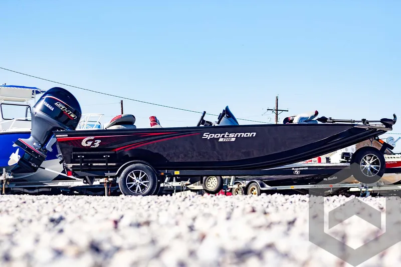 Slide: The Image of 2025 G3 Sportsman 1710 boat on trailer, side view, outdoors. - 6