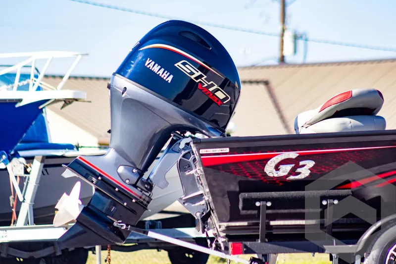 Slide: The Image of 2025 G3 Sportsman 1710 boat with Yamaha outboard motor, parked outdoors. - 8