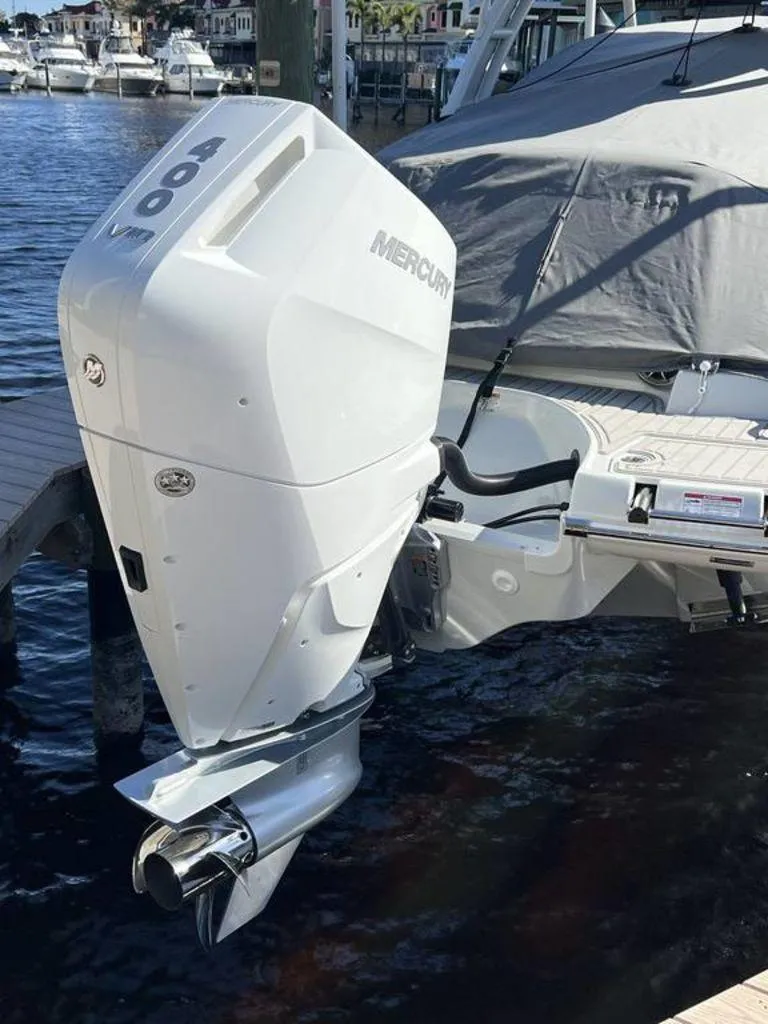 Slide: The Image of Crownline 290 XSS 2025 with Mercury 400 outboard engine at dock. - 4