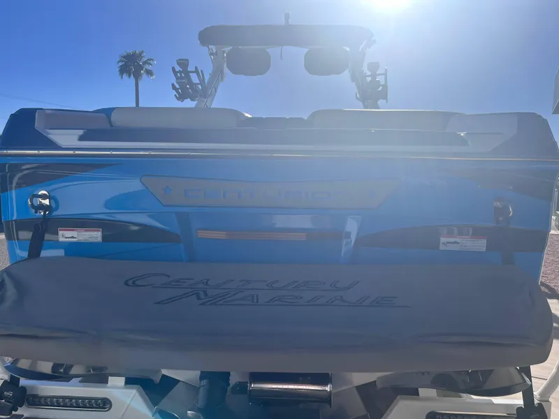 Slide: The Image of 2022 Centurion Ri265 boat rear view under bright sunlight. - 14
