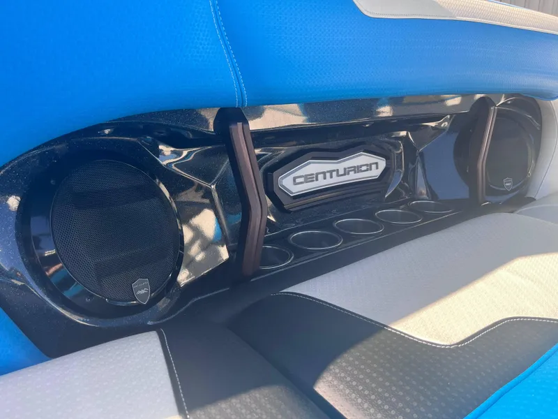 Slide: The Image of Centurion Ri265 2022 boat interior with speakers and blue upholstery. - 9