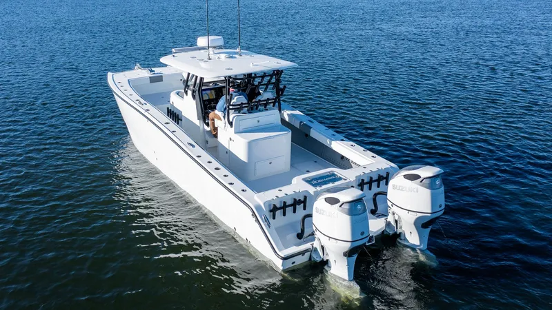 Slide: The Image of Freeman 34VH 2020 boat cruising on open water, rear view. - 10