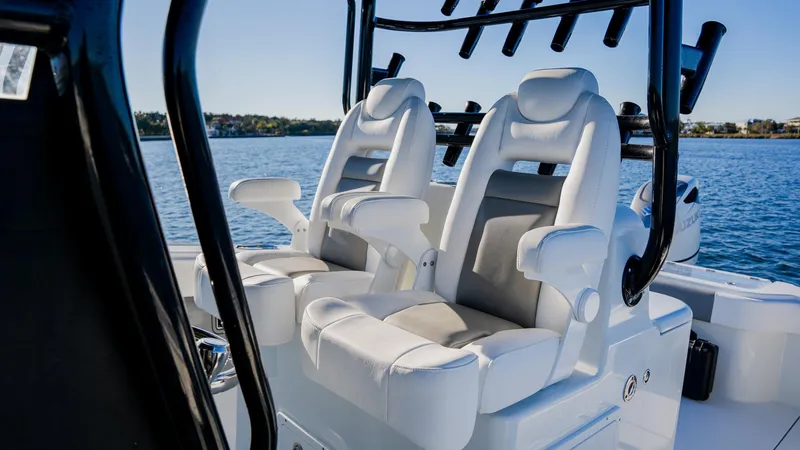 Slide: The Image of Luxury seating on 2020 Freeman 34VH boat, overlooking serene water. - 16