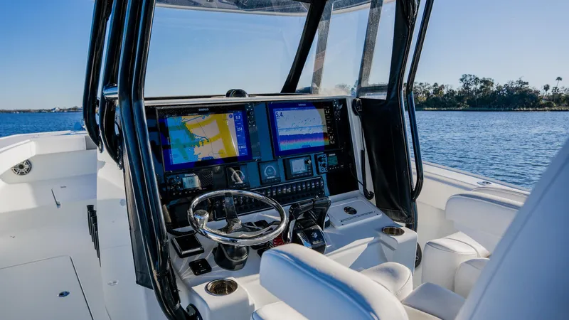 Slide: The Image of Freeman 34VH 2020 boat cockpit with advanced navigation systems on a sunny day. - 18