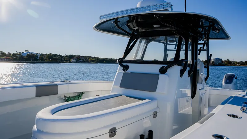 Slide: The Image of Freeman 34VH 2020 boat on calm water, featuring sleek design and modern equipment. - 21