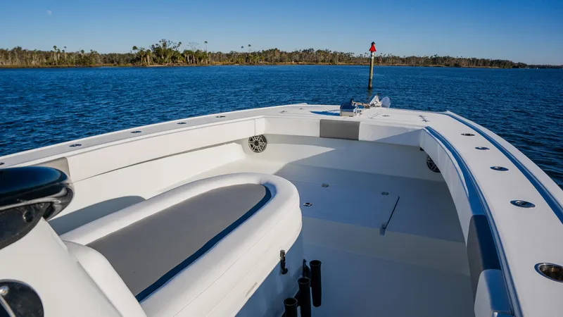 Slide: The Image of Freeman 34VH 2020 boat on calm water, showcasing spacious deck and sleek design. - 23