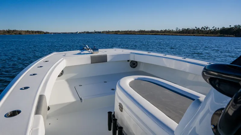 Slide: The Image of Freeman 34VH 2020 boat on calm water, clear sky, spacious deck view. - 24
