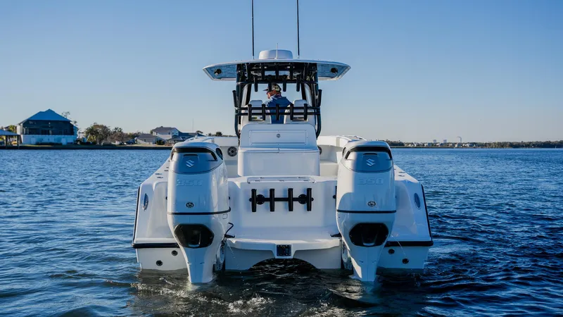 Slide: The Image of Freeman 34VH 2020 boat on water, rear view with dual engines. - 3