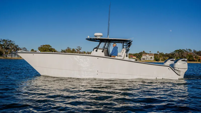 Slide: The Image of 2020 Freeman 34VH boat on calm water under clear blue sky. - 4