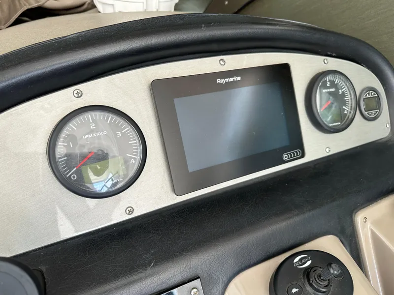 Slide: The Image of Dashboard of 2009 Cruisers Yachts 420 Express with Raymarine display and gauges. - 16