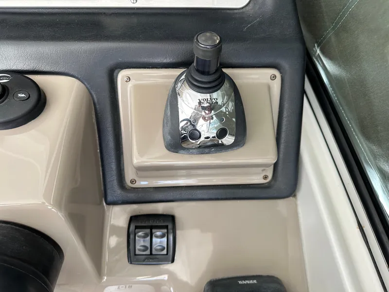 Slide: The Image of 2009 Cruisers Yachts 420 Express joystick control panel, featuring Volvo Penta system. - 19