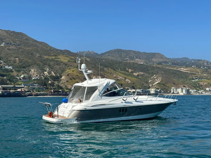 Slide: The Image of 2009 Cruisers Yachts 420 Express on scenic coastal waters. - 2