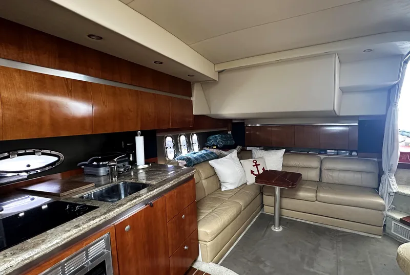Slide: The Image of Luxurious 2009 Cruisers Yachts 420 Express interior with leather seating and modern kitchen amenities. - 22