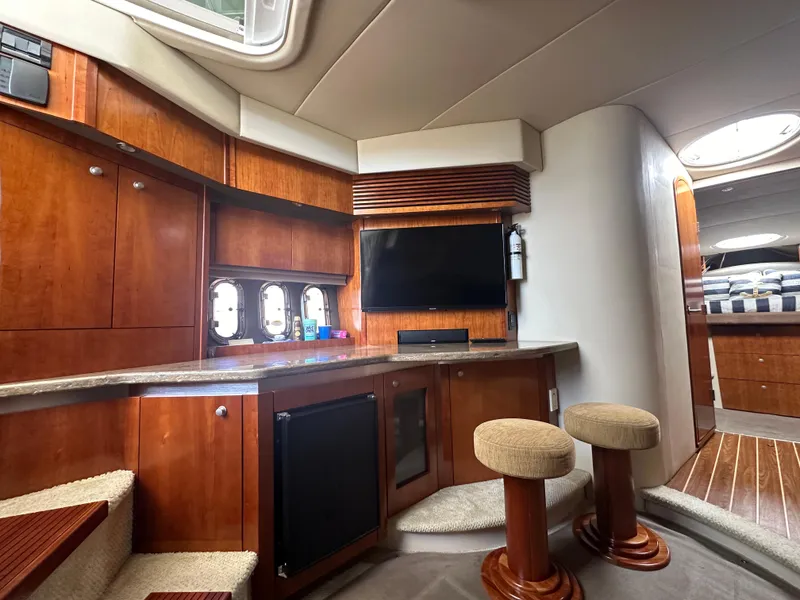 Slide: The Image of Luxurious 2009 Cruisers Yachts 420 Express interior with wood cabinetry and modern amenities. - 27