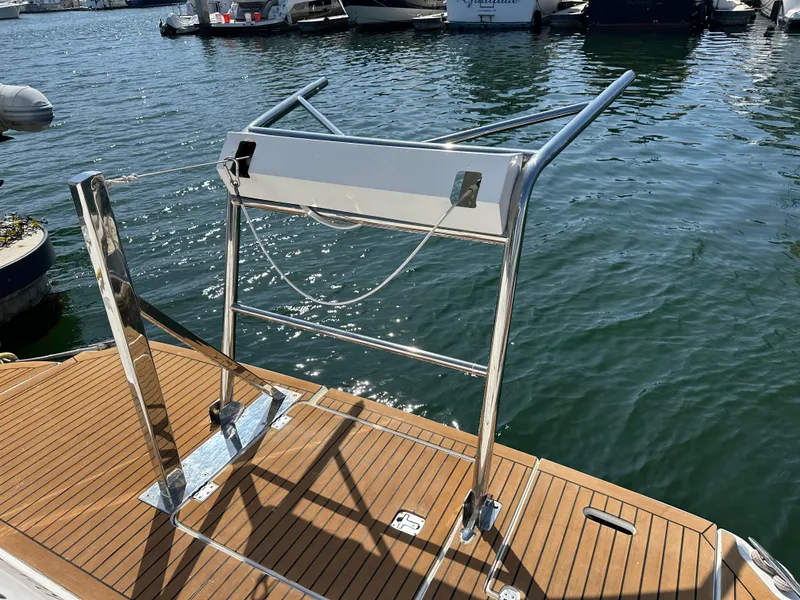 Slide: The Image of 2009 Cruisers Yachts 420 Express swim platform with stainless steel ladder, docked in marina. - 5