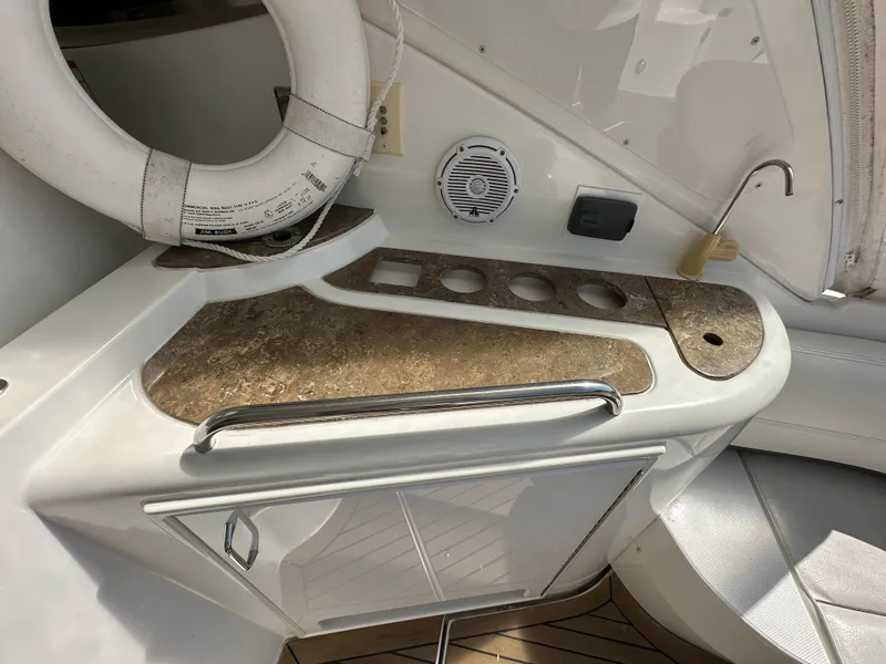 Slide: The Image of 2009 Cruisers Yachts 420 Express interior with countertop, sink, and life preserver. - 9