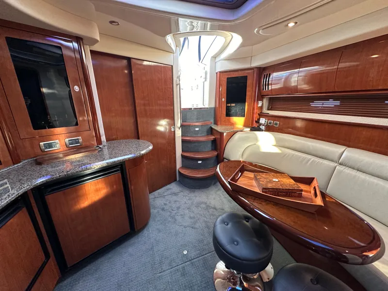 Slide: The Image of Luxurious 2005 Sea Ray 420 Sundancer interior with elegant wood finishes and modern amenities. - 35