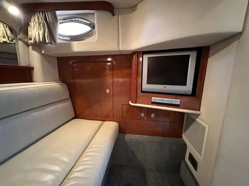 Slide: The Image of Interior of 2005 Sea Ray 420 Sundancer with TV and leather seating. - 48
