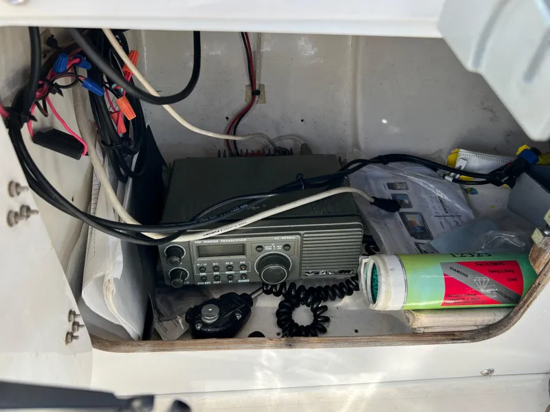 Slide: The Image of 1973 Bertram 31 Flybridge Cruiser radio compartment with communication equipment and wiring. - 30