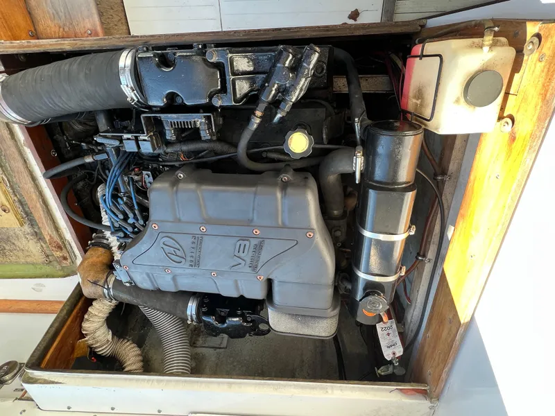 Slide: The Image of Engine compartment of a 1973 Bertram 31 Flybridge Cruiser, showcasing mechanical components. - 40