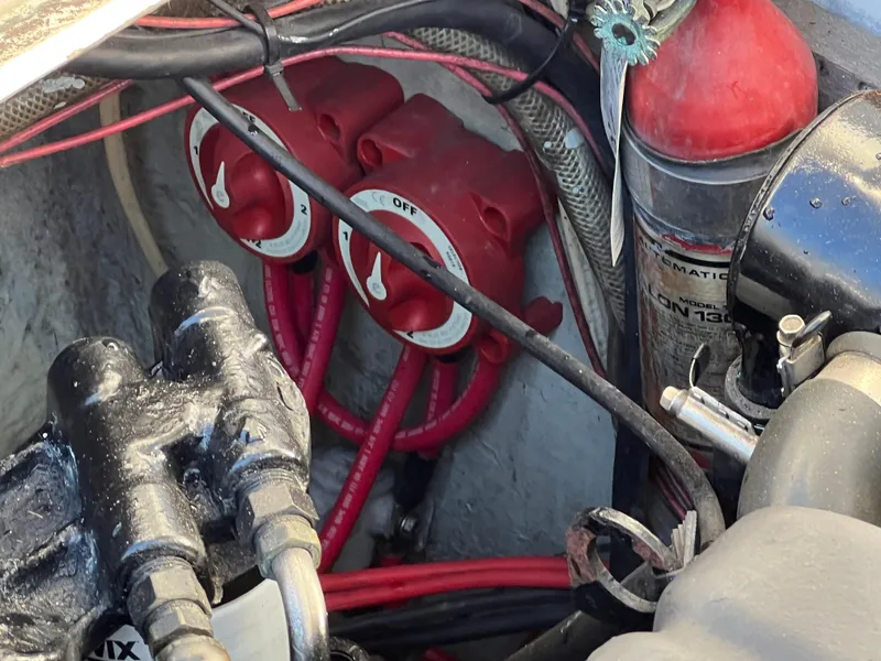 Slide: The Image of Engine compartment of 1973 Bertram 31 Flybridge Cruiser with battery switches and wiring. - 43